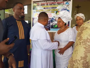 Rev. Father Ilechukwu with Mrs. Ifeoma Udeaja, Yagazie and Ikenna.